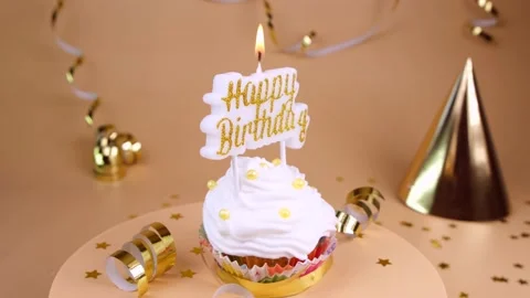 Birthday cake or cupcake with burning candle with the inscription Happy Birthday Stock Footage 197017471