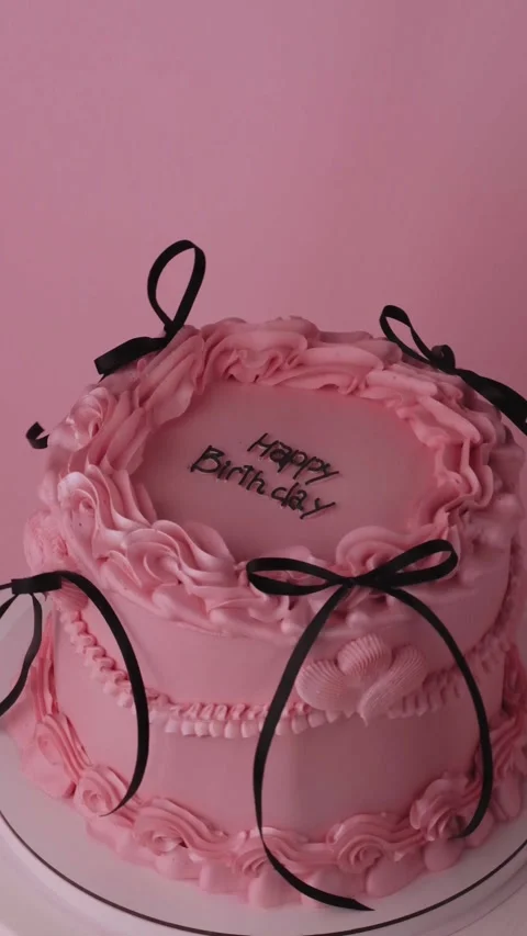Birthday cake rotating on pink background Stock Footage 310265961