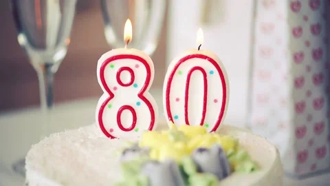 Birthday candle as number eighty 80 on top of sweet cake on the table Stock Footage 150255631