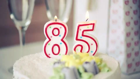 Birthday candle as number eighty five 85 on top of sweet cake on the table Stock Footage 150255628