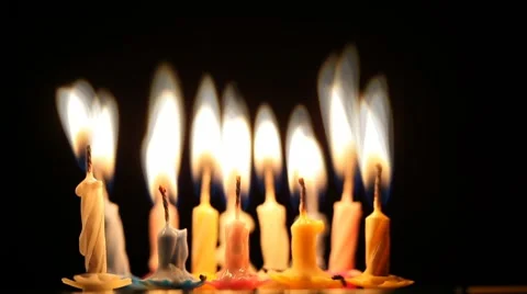 Birthday candles changing into fire Stock Footage 7749087