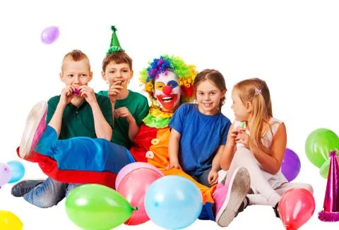 Birthday child clown playing with children. Kid holiday cakes celebratory. Stock Photos