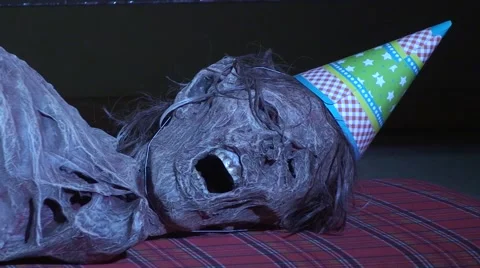 Birthday corpse with party hat - Halloween, Horror Stock Footage 66421350