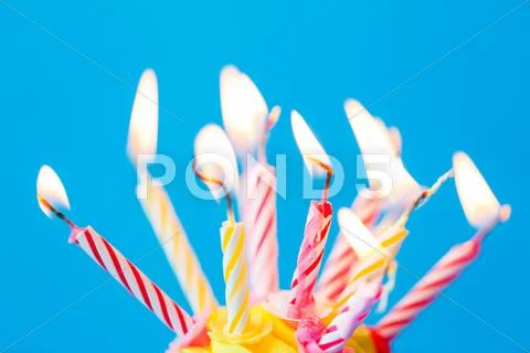 Birthday cupcake with many burning candles Stock Photos