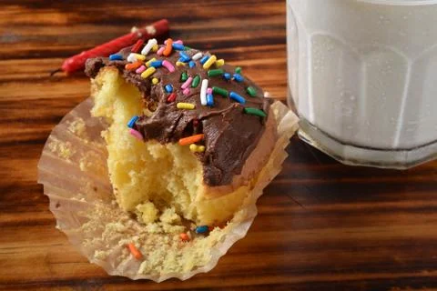 Birthday cupcake with a missing bite Stock Photos