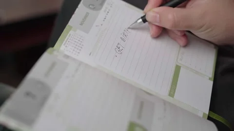 Birthday Gift Shopping Task Added to Paper Diary Page Stock Footage 343974739