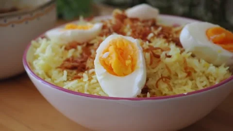 Biryani with boiled eggs served in a bowl Stock Footage 342380715