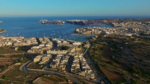 Birzebbuga, Malta - 07/07/2024: Drone sunset view of city, boats, marina Stock Footage 278887251