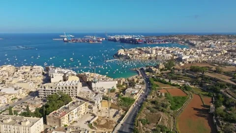 Birzebbuga, Malta - 07/07/2024: Drone view of port and city, boats on the see Stock Footage 278885648