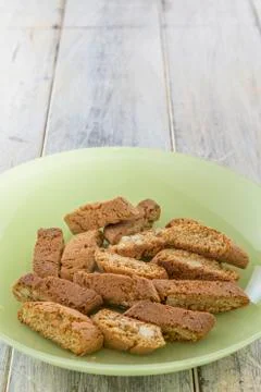 Biscotti on green plate Stock Photos