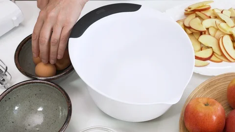 Biscuit batter preparation process. Beating eggs step by step. Cooking apple pie Video stock 129183131