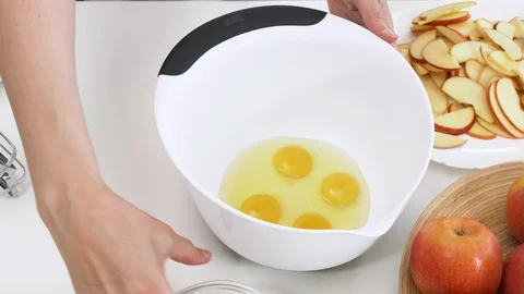 Biscuit batter preparation process. Combine sugar and eggs. Cooking apple pie. Stock Footage 129181046