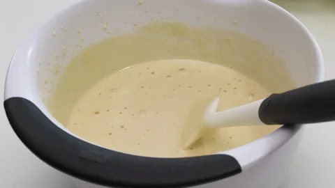 Biscuit batter preparation process. Mixing dough in a bowl.  Stock Footage 129192733