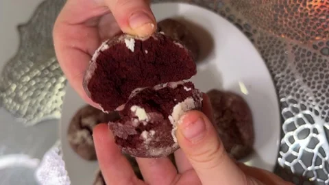Biscuit broken in two with hand Stock Footage 230077517