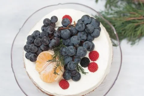 Biscuit cake with fruit hat Stock Photos