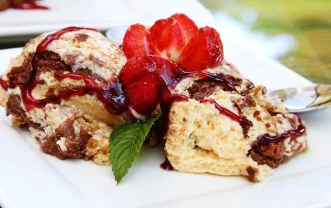 Biscuit cake with strawberries Stock Photos