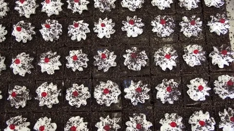 Biscuit cakes sprinkle chocolate chips on top Stock Footage 80587907