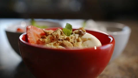 Biscuit/ Cookie pieces dropping onto Vanilla ice cream with other ice cream Stock Footage 162670394