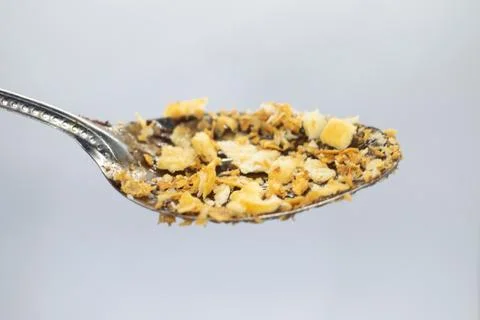 Biscuit flakes stuck to the spoon Stock Photos