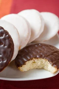 A biscuit with a missing bite Stock Photos