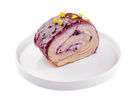 Biscuit or sponge cake roll on plate Stock Photos