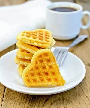 Biscuit in the shape of heart on a plate A stack of cookies in the shape o... Stock Photos