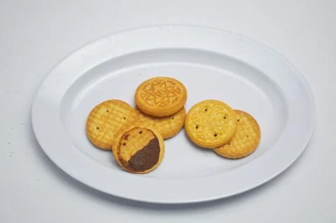 BISCUIT ON A WHITE PLATE Stock Photos