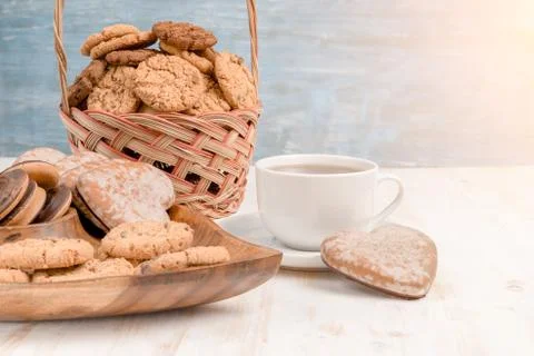 Biscuits and cup of tea on table in the morning Stock Photos
