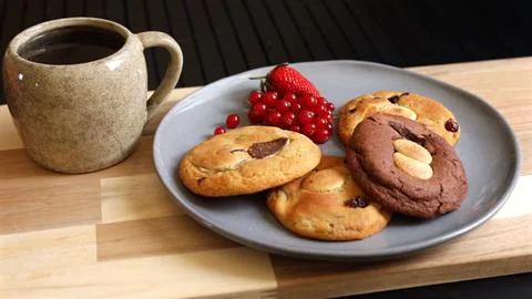 Biscuits and tea bring simple comfort to your morning. Paired with fresh berries Stock Photos