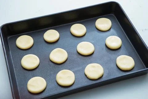Biscuits on a baking sheet Stock Photos