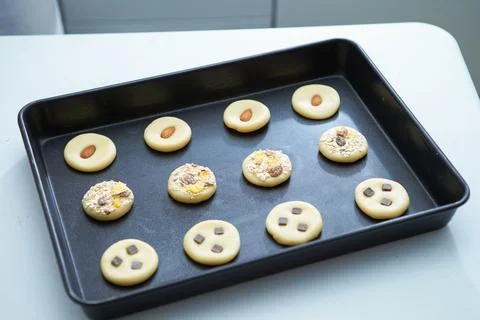 Biscuits on a baking sheet Stock Photos