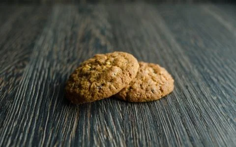 Biscuits on cereal on wood background Stock Photos