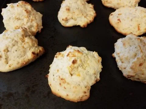 Biscuits with cheese on metal baking tray Stock Photos