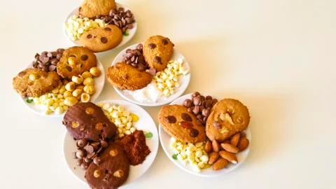 Biscuits with chocolate chips and almonds, hazelnuts or cocoa powder Stock Photos