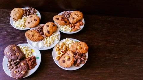 Biscuits with chocolate chips and almonds, hazelnuts or cocoa powder Stock Photos