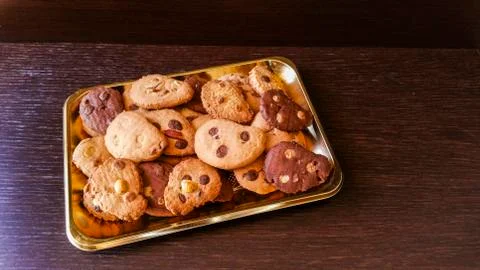 Biscuits with chocolate chips and almonds, hazelnuts or cocoa powder Stock Photos