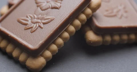 Biscuits with chocolate tablet rotating Stock Footage 242302124