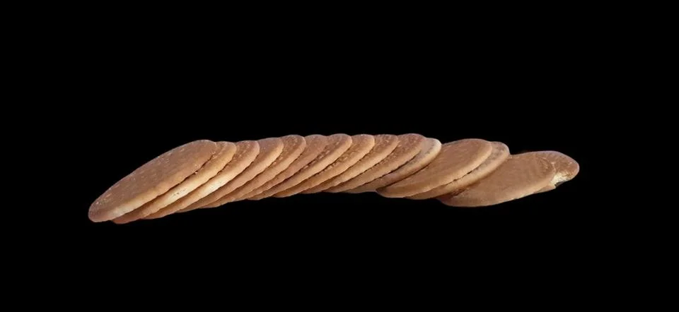 Biscuits with dark black background Stock Photos