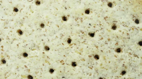 Biscuits with a detailed textured surface are rotated close up. Macro. Stock Footage 155282752