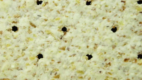 Biscuits with a detailed textured surface are rotated close up. Macro. Stock Footage 155284380