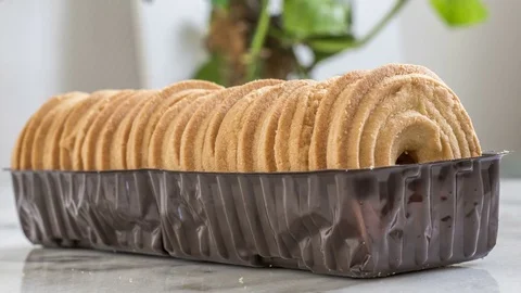 Biscuits disappearing from a plastic package Stock Footage 73928173