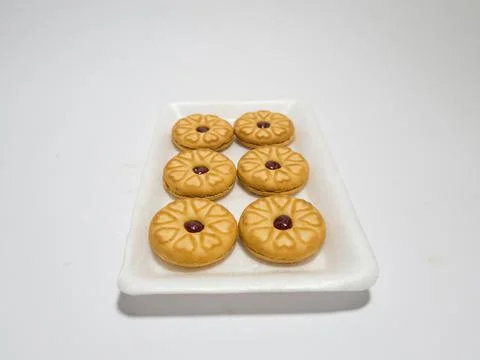 Biscuits filled with strawberry jam Stock Photos