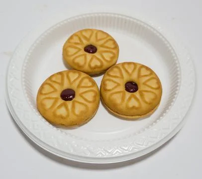 Biscuits filled with strawberry jam Stock Photos