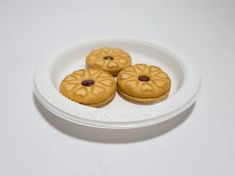 Biscuits filled with strawberry jam Stock Photos