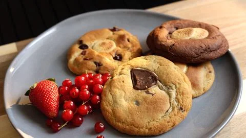 Biscuits on grey plate offer simple comforting breakfast With fresh berries and Stock Photos