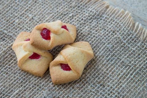 Biscuits with jam in the form of an envelope, on natural rustic background, h Stock Photos