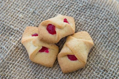 Biscuits with jam in the form of an envelope, on natural rustic background, h Stock Photos