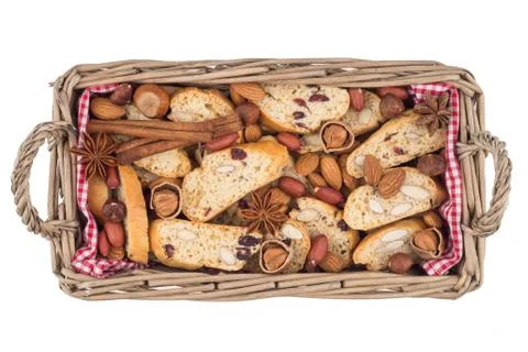 Biscuits with nuts in a basket isolated on white background. Stock Photos