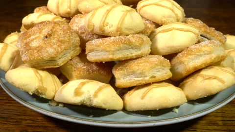 Biscuits piled up on a plate on a table. Stock Footage 221228677