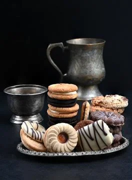 Biscuits served alongside a cup of tea or coffee Stock Photos